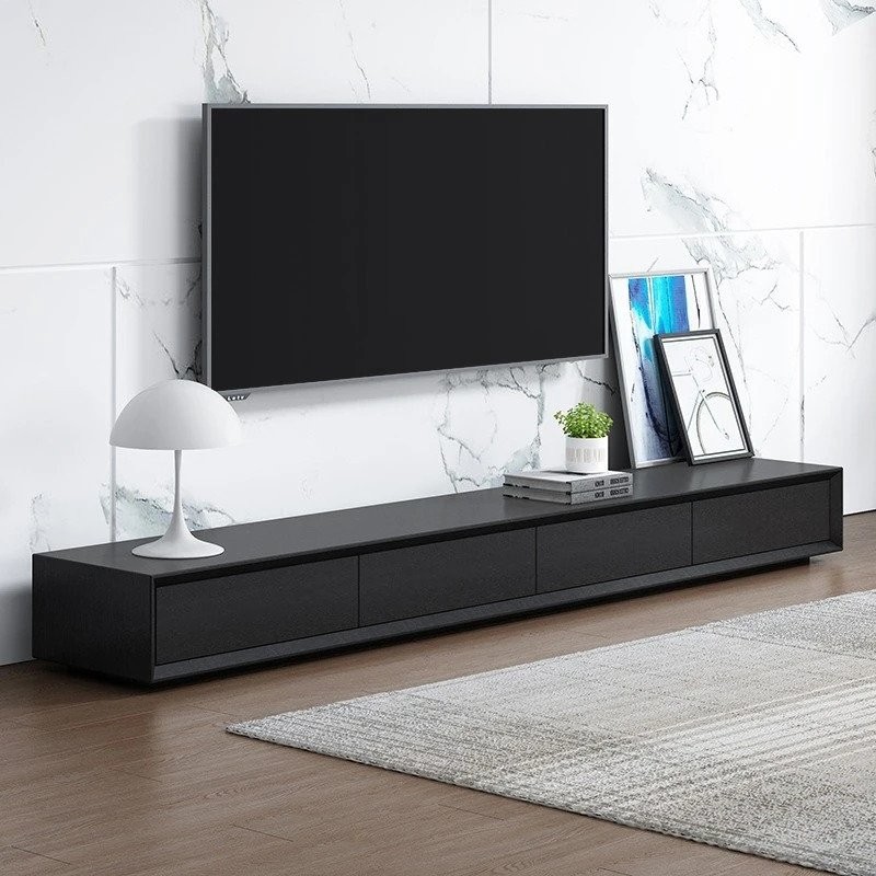 This low-profile TV stand is a commodity that is modern, sleek, and eye-catching. The forward edge has a smooth luster enhanced by the delicate chrome metal handles, creating a genuine eye-catcher. Sleek and elegant, this TV stand has a steep design with clean lines and a fundamental aspect, making it an ideal supplement to any area in the house. Not only can a blocky roleplaying store your cable box and playstation, but it may also be used to display artwork, decorations, and nick-knacks. This TV stand will add a dash of minimalist appeal to your modern design. It has an elegant, understated design that maximizes utility.