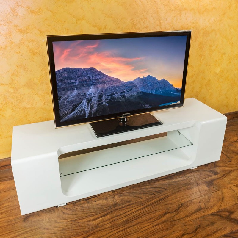 Your living room arrangement is incomplete without a TV stand, Revamp your space with this contemporary style white corral TV stand. This design also lends your space a rich look while highlighting all the features of modern detailing. Featuring a 60” TV with a strong top and a tempered glass shelf with a bottom shelf to match your audio, video, gaming, or decoration needs.